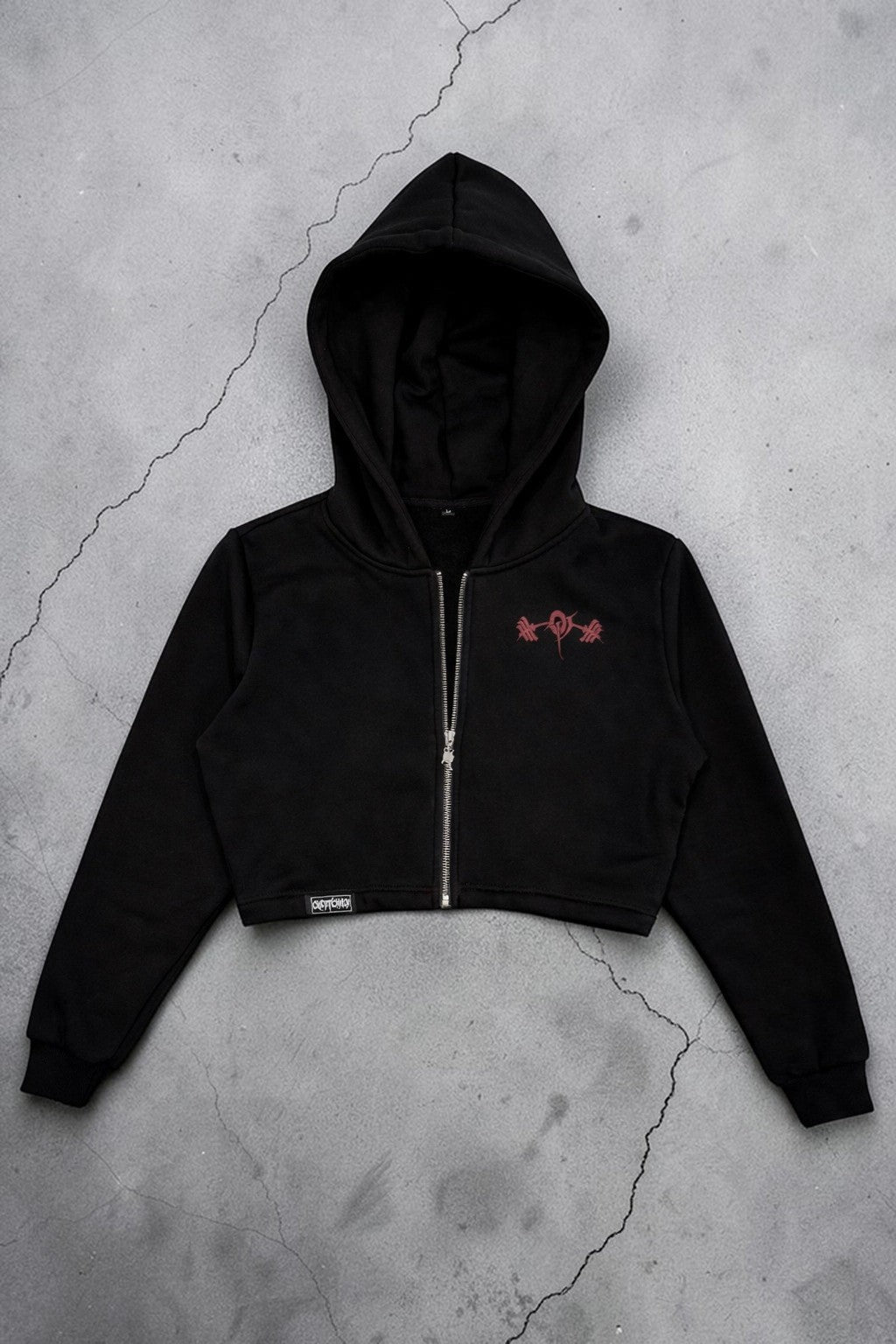 OverPower Strength Wear black cotton fleece crop zip-up hoodie with red graphic detail and metal zipper.