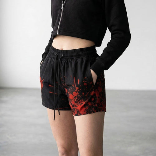 OverPower Strength Wear unisex black shorts with red blood splatter graphic, nylon/spandex blend, drawstring waist.